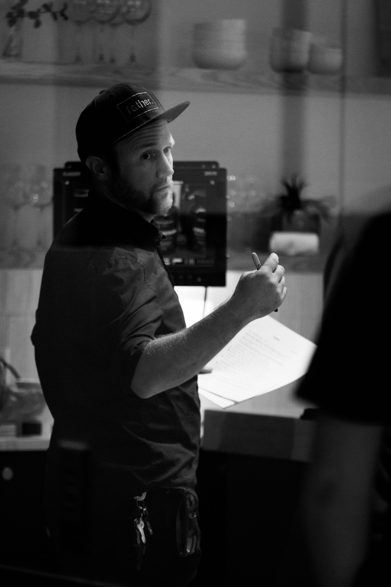 Black and white on-set photograph of Kyler Wilson